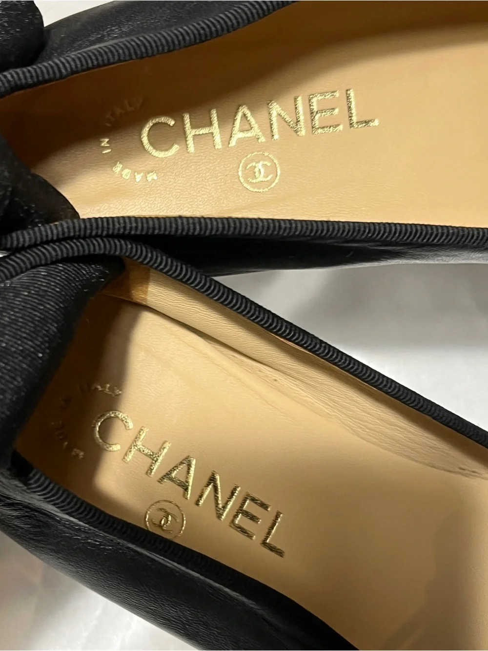CHANEL Black Leather Ballet Flats with Patent Cap Toe & CC Motif